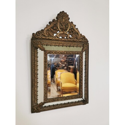 19th C. embossed brass cushion mirror {70 cm H x 43 cm W}.