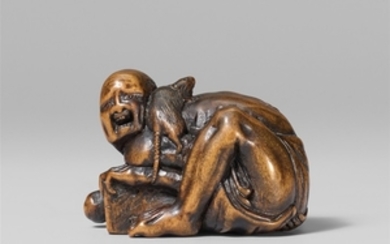 A small boxwood netsuke of a disappointed rat catcher, by Ichimin. Mid-19th century