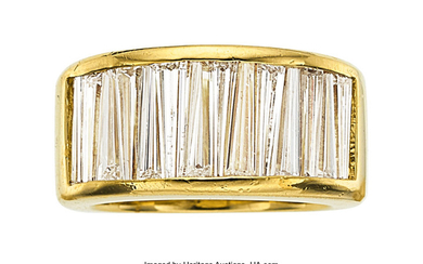 Diamond, Gold Ring The ring features tapered baguette...