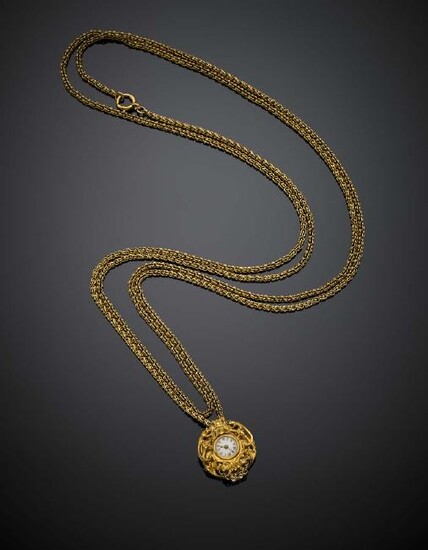 Yellow gold double chain holding a baroque pendant