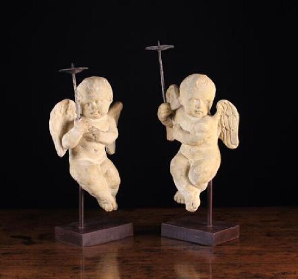 A Pair of Carved Limestone Cherubs. The delightful