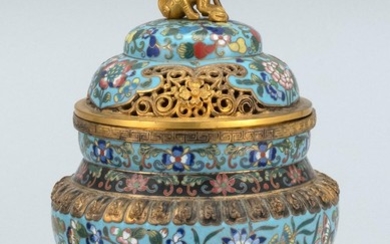 CHINESE CLOISONNÉ ENAMEL KORO In tripod ovoid form, with domed cover, lion finial, and elephant's-head feet. Body decorated with but..