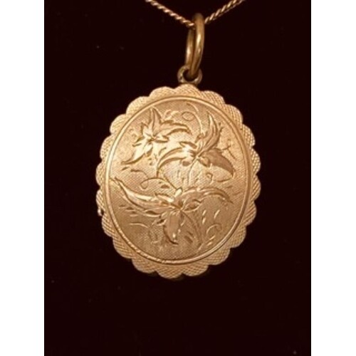 9ct yellow gold Locket engraved to the front with a floral p...
