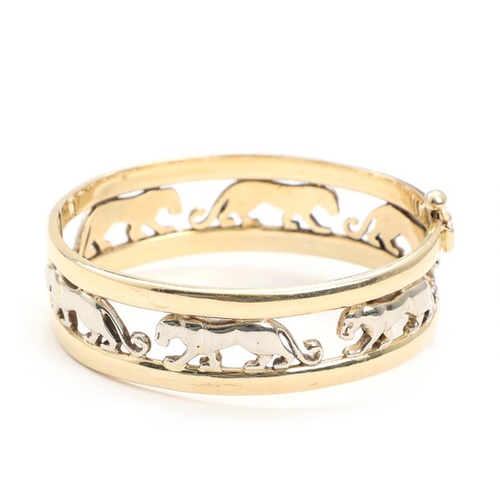 A 14k gold and white gold panther bangle. Inside 5.6×6.4 cm. Weight app. 45 g.