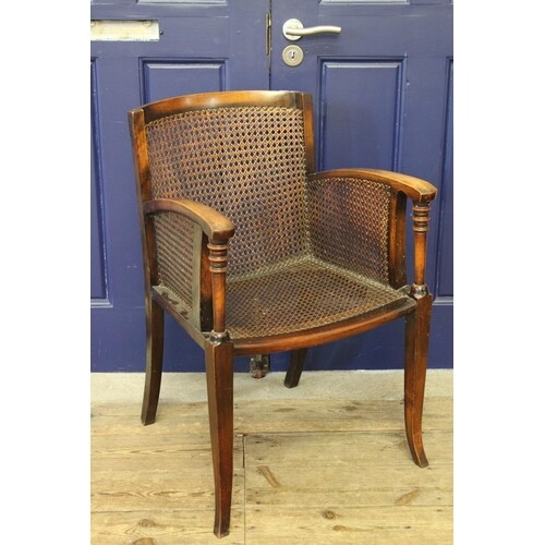 A 1920's Beech framed "Bergere" panelled drawing room chair ...