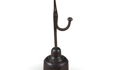 A 19TH CENTURY FORGED IRON TABLE RUSH LIGHT