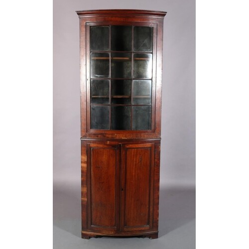 A 19TH CENTURY MAHOGANY BOW FRONT STANDING CORNER CUPBOARD, ...