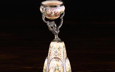 A 19th Century Viennese Enamelled Wager Cup, in the form of a lady wearing a flared inverted cup-for