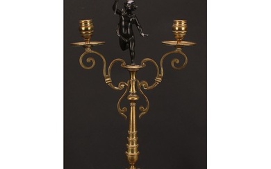 A 19th century dark patinated bronze mounted two-branch cand...