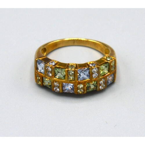 A 9ct. Gold Band Ring set peridot, aquamarine and small diam...