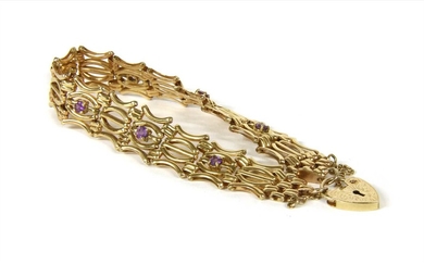 A 9ct gold amethyst five row gate bracelet
