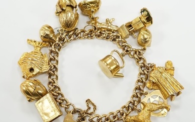 A 9ct gold curb link charm bracelet, with heart shaped padlo...