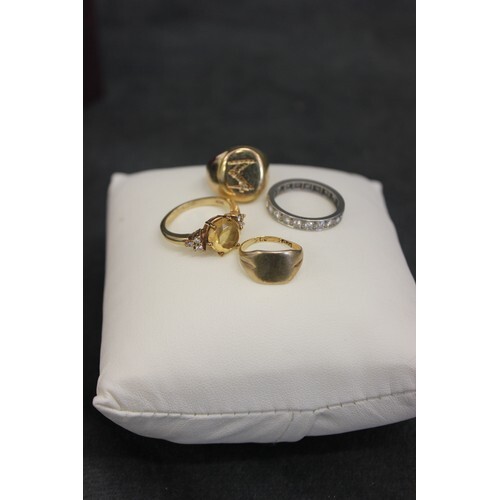 A 9ct gold dress ring set a yellow topaz, a small signet typ...