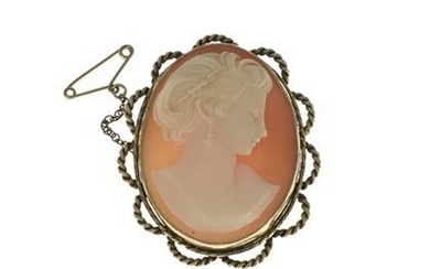 A 9ct gold shell cameo brooch, carved to depict a lady in pr...