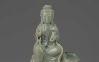 A CHINESE CELADON JADE CARVING OF A GUANYIN, CHINA