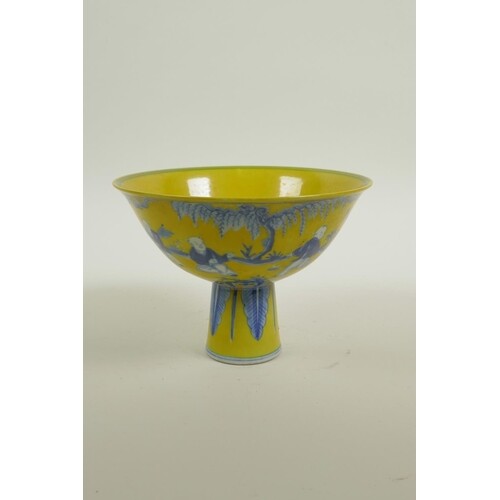 A Chinese Ming style yellow ground porcelain stem bowl with ...