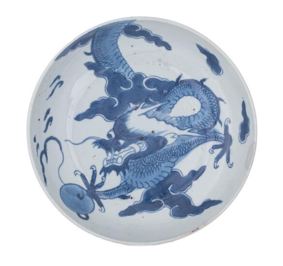 A Chinese blue and white dragon dish, probably for the...