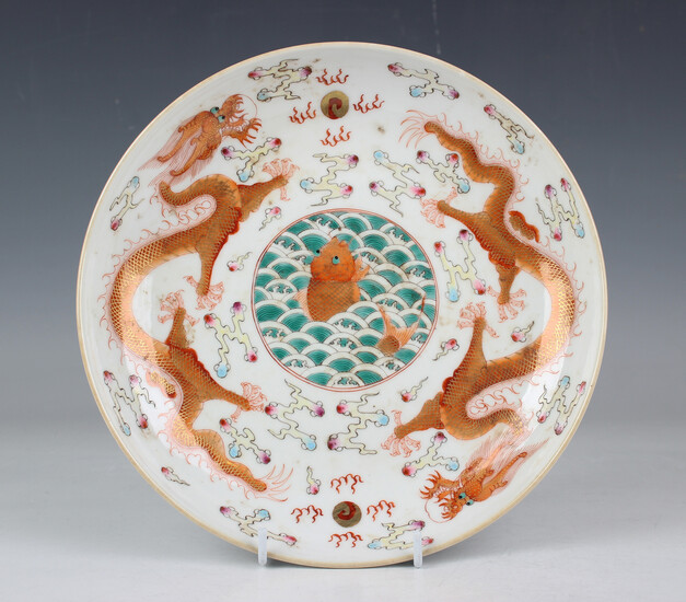 A Chinese famille rose porcelain saucer dish, mark of Jiaqing but probably late 20th century, the ce