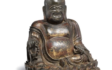 A Chinese patinated bronze Budai seated on a double lotus throne. Late Ming-Early Kangxi, 17th century. Weight 4323 g. H. 24.5 cm.