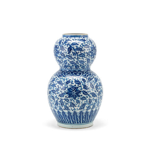 A Chinese porcelain blue and white double gourd vase in the Ming style, probably 19th century