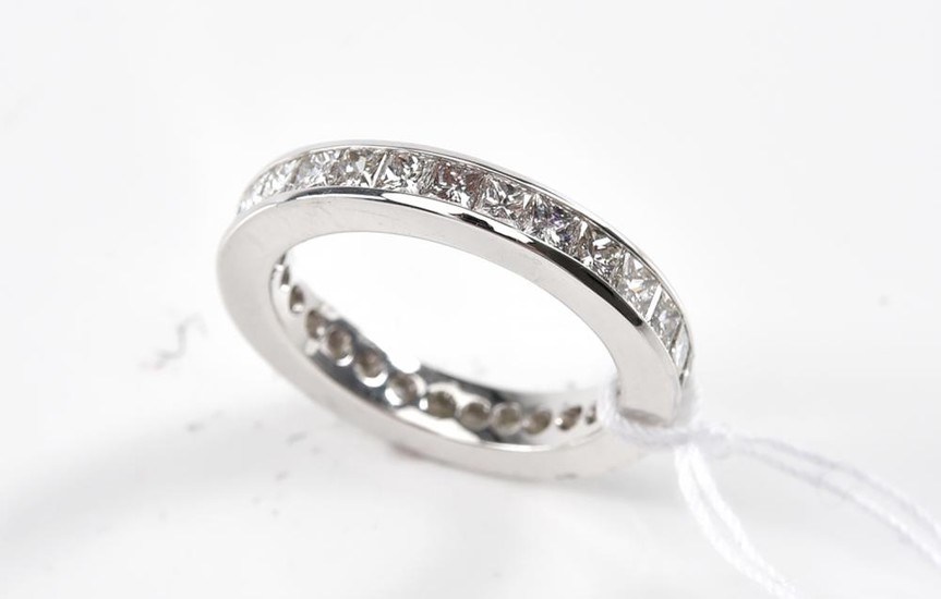 A DIAMOND ETERNITY RING-The full circle ring set with princess cut diamonds totalling 2.18cts, in 18ct white gold, ring size J.