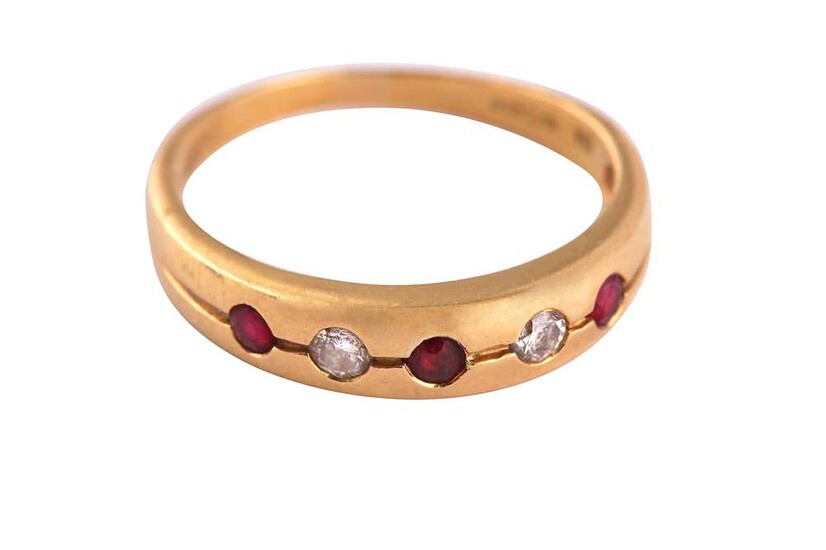 A FIVE STONE RUBY AND DIAMOND RING