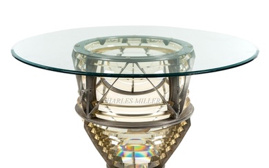 A FRESNEL LENS COFFEE TABLE composed of two sections of Fres...