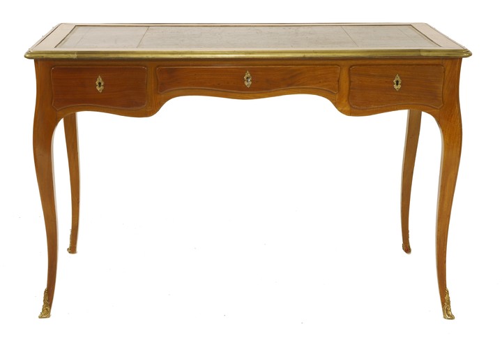 A French Louis XV-style mahogany and gilt metal-mounted writing table