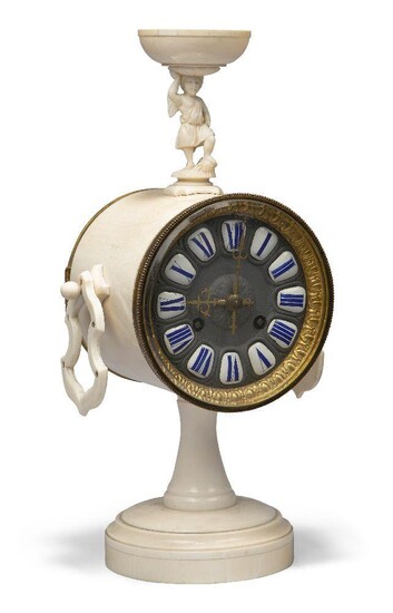 A French ivory mantel clock, the late 19th century, the cylinder case surmounted by a winged putto supporting a bowl, with shaped handles, the dial with white enamel Roman chapters, 34cm high Please note that Roseberys do not guarantee working...