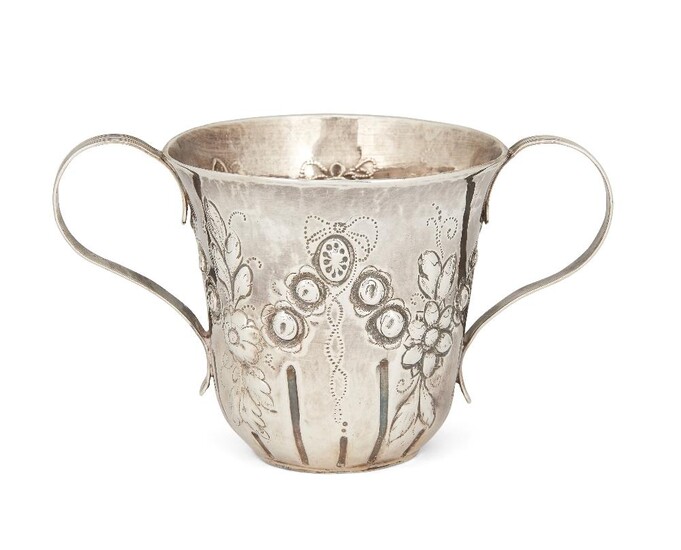 A George III silver porringer cup, London, 1783, maker's mark indistinct, with reeded twin handles and repousse floral garland decoration to body, 7.5cm high, approx. weight 2.8oz