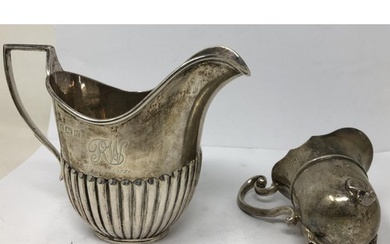 A George V silver cream jug, Birmingham 1922, and another sm...