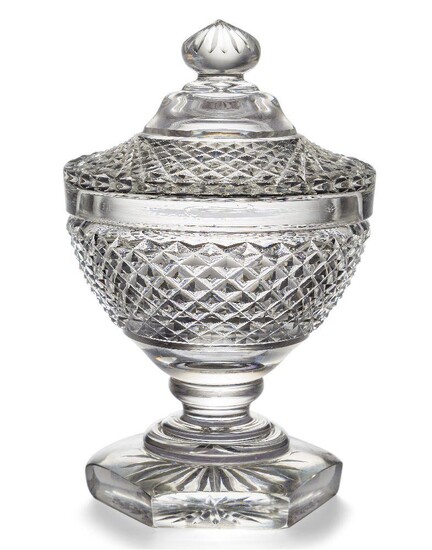 A Georgian Anglo-Irish cut crystal pedestal sweetmeat bowl and cover, 19th century, the bowl and cover with diamond cut pattern, atop hexagonal base with star design to the underside, 32.5cm high