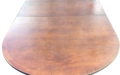 A Georgian style twin pedestal mahogany dining table, the...
