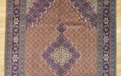 A HANDKNOTTED PURE WOOL PERSIAN TABRIZ RUG