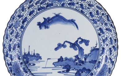 A JAPANESE KAKIEMON STYLE BLUE AND WHITE DISH -...