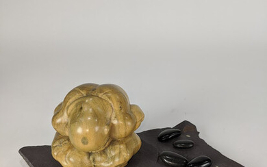 A Japanese Modern carved wood figure of a seated couching man