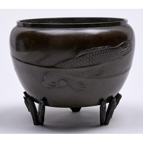 A Japanese bronze bowl, Meiji period, finely cast with three...