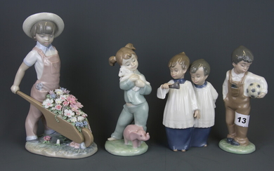 A Lladro porcelain figure of a child with a wheelbarrow filled with flowers and three further Nao porcelain figures of children, tallest H.