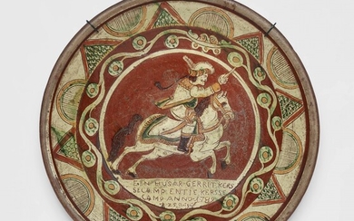 A Lower Rhenish earthenware dish with a hussar