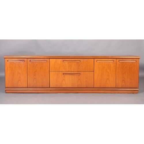 A Meredew suite of teak sideboard having two drawers to the ...