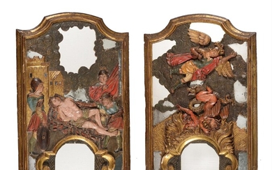 A PAIR OF SPANISH GILTWOOD FRAMED MIRRORS OVERLAID WITH CARVED RELIEFS OF ST LAWRENCE AND ST MICHAEL