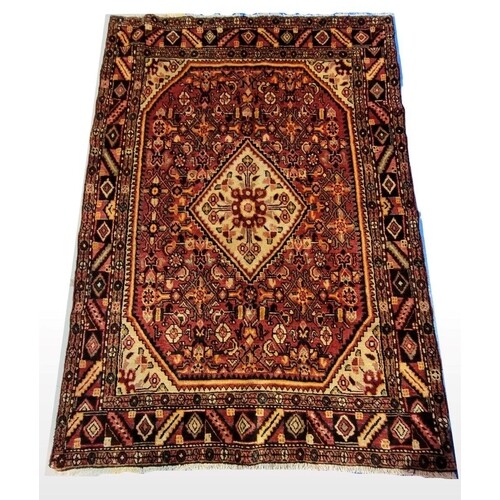 A PERSIAN HAND KNOTTED HAMADAN FLOOR RUG, early 20th century...