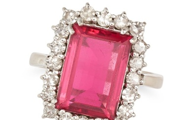 A PINK TOURMALINE AND DIAMOND CLUSTER RING set with an octagonal step cut pink tourmaline in a