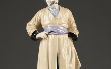 A PORCELAIN FIGURE OF A COSSACK In the manner of the Gar