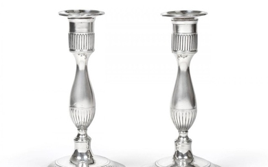 A Pair of George III Silver Candlesticks, by John Lindley...