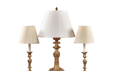 A Pair of Louis XV Style Gilt Bronze Candlesticks Now Mounted as Lamps, Together with a Louis XV Style Candlestick Now Mounted as a Lamp