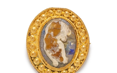 A Roman Gold and Glass Cameo Brooch with a Sleeping Dog