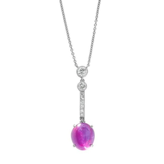 A STAR RUBY AND DIAMOND PENDANT NECKLACE set with a