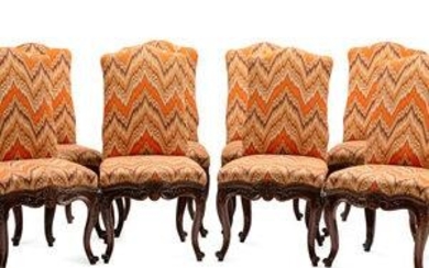 A Set of Eight Continental Carved Walnut Dining Chairs