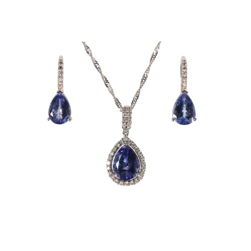 A TANZANITE AND DIAMOND CLUSTER PENDANT WITH EARRINGS ENSUI...